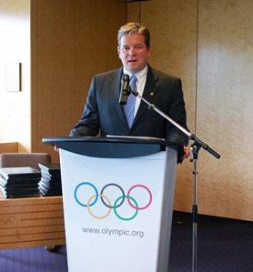 photo of Matt Robinson speaking at IOC HQ