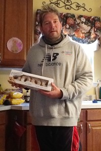 photo of Matt Robinson with donuts