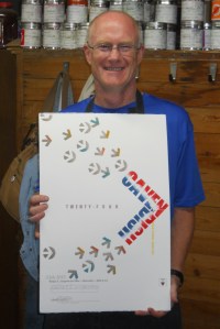photo of Mark Deshon with poster