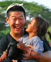 photo of Enoch Lee and little girl