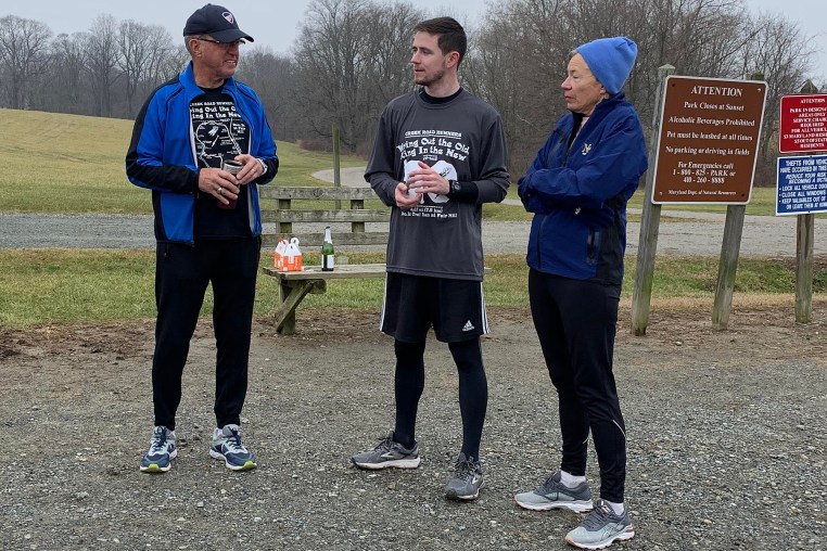 photo of Jordan talking with Bruce and April