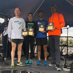 photo of relay team with plaques