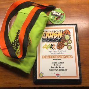 photo of Diane Kukich's Crushing the Pandemic plaque and ribbon