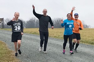 photo of Bill Rose, Doug Repetti, Shuang Liu, and Bob Opila finishing