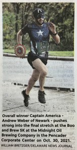 Delaware News Journal photo of Andrew Weber as Captain America in a 5K